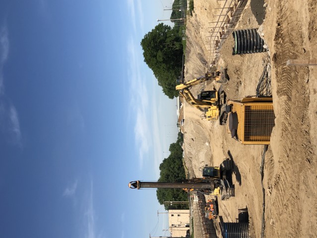 Top down construction on retaining walls along I-490 west of East 55th Street in June 2020.