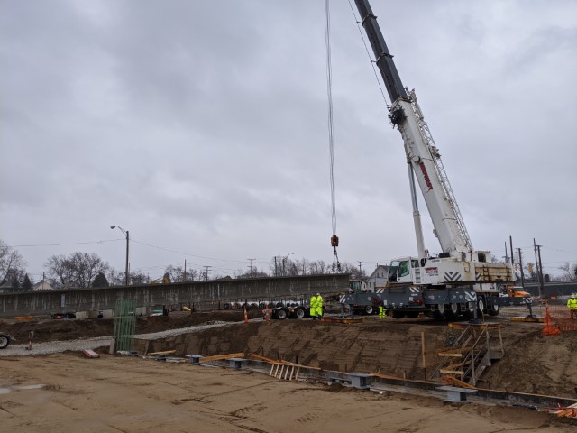One-hundred-foot-long beams were placed on the new East 55th Street bridge over the new boulevard in March 2020.