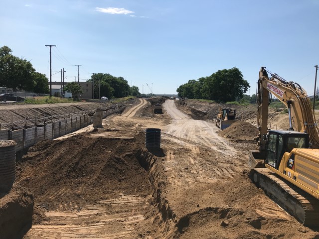 Mass excavation work along I-490 west of East 55th Street to lower the roadway approximately 20’ for the new boulevard to pass under East 55th Street is currently underway in June 2020.